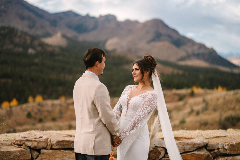 Bride and Groom holding hands during their wedding ceremony