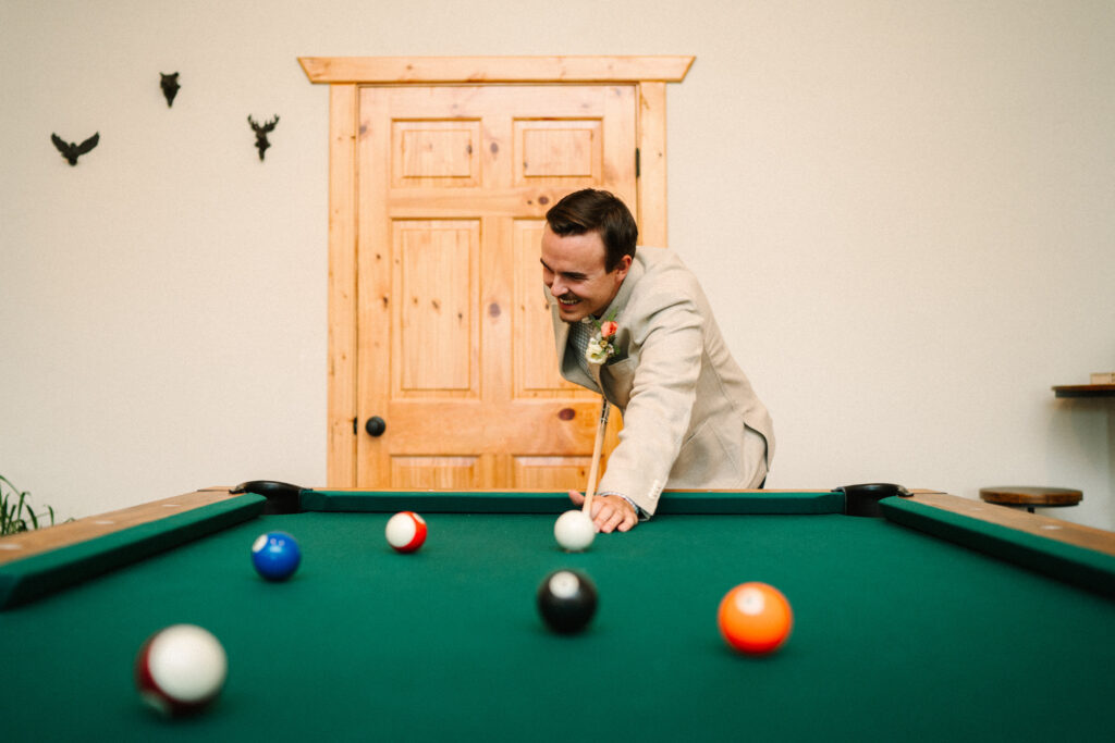 Groom at the pool table