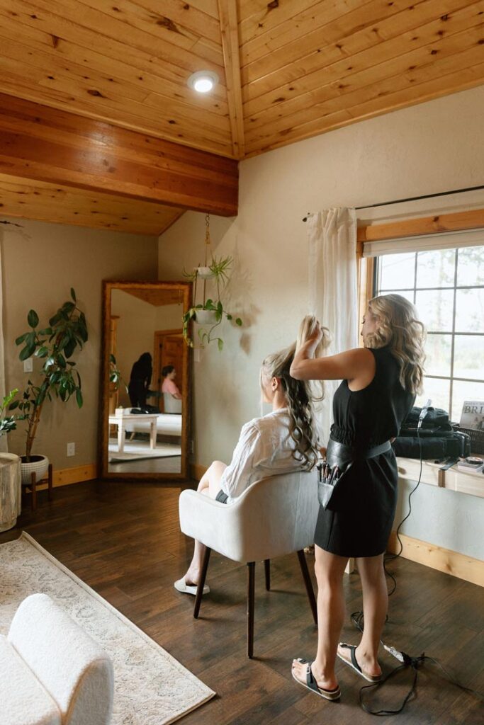 Bride Getting Her Hair Done in Bridal Suite