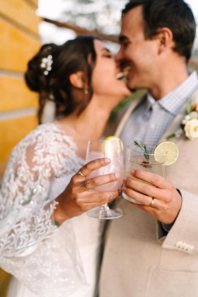 Wedding Couple Shares First Drink During Cocktail Hour