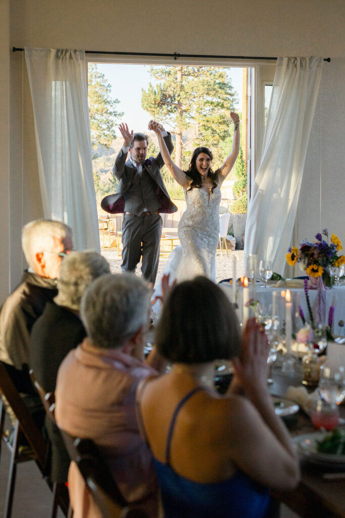 Bride and Groom Enter Reception in Colorado Springs Wedding Venue